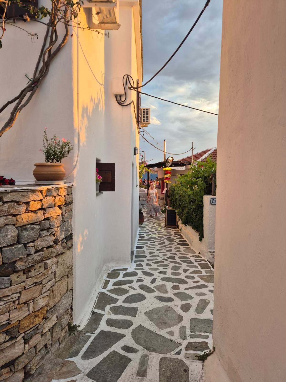 A whitewashed lane with stone paving in Alonissos